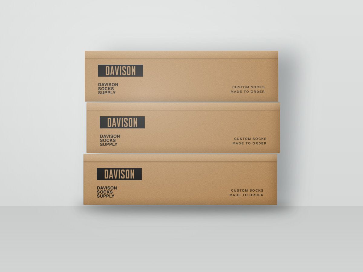 Three stacked kraft shipping boxes printed with the Davison Socks Supply logo